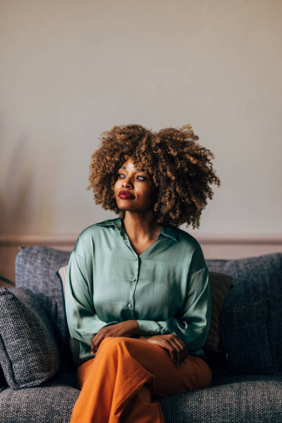 istock A Happy Beautiful Woman Looking Away While Relaxing At Home 1487069590