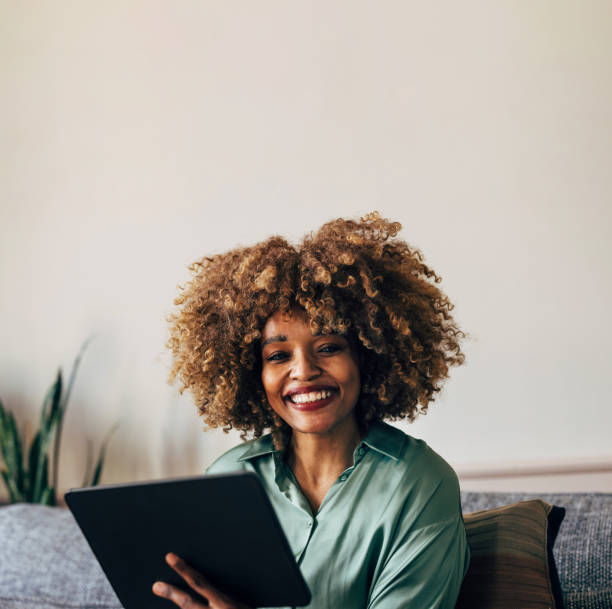 istock A Happy Beautiful Businesswoman Looking At Camera While Working 1487069635