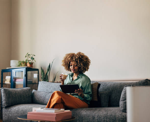 istock A Happy Beautiful Businesswoman Drinking Coffee While Working Fr 1487069640