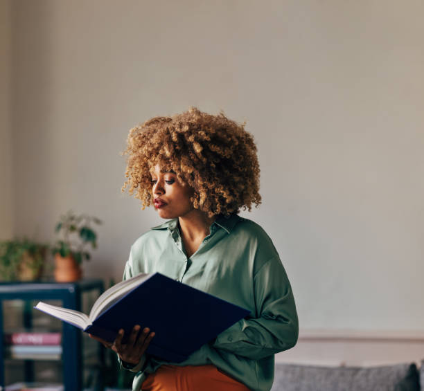 istock A Beautiful Woman Reading A Book 1487069745