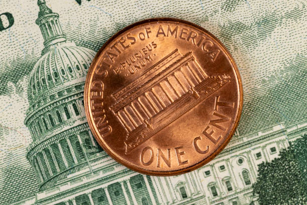 copper American coins with a face value of one cent , a close-up of old coins of 1 cent