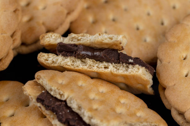 istock crispy cookies with chocolate filling between cookies 1487075515