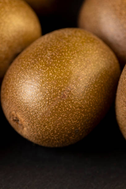 a group of ripe whole kiwis yellow, pure kiwis