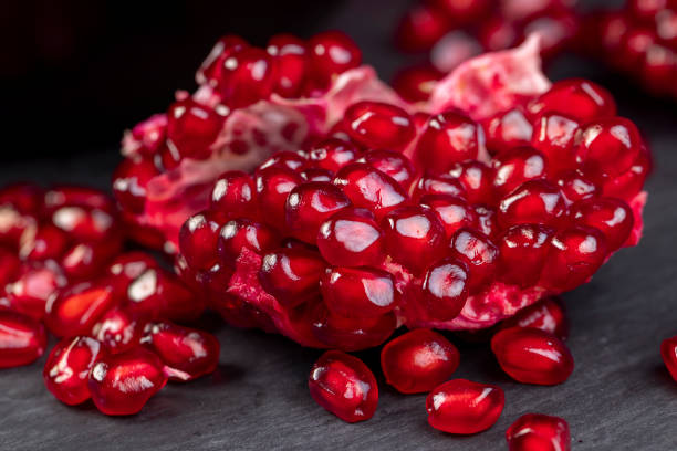 istock Grains of red ripe pomegranate close up 1487076161