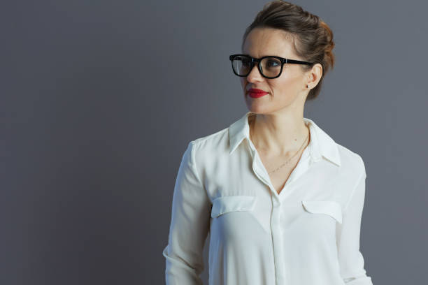 istock pensive elegant woman worker against grey background 1487079101