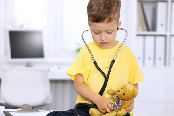 istock Little doctor examining a toy bear  patient by stethoscope 1487079603