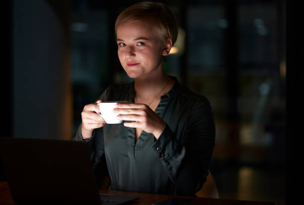 istock Coffee, serious and woman in dark office working late night,  commitment and dedication with time management. Portrait of businesswoman, overtime and relax on tea break at evening work at startup. 1487079948