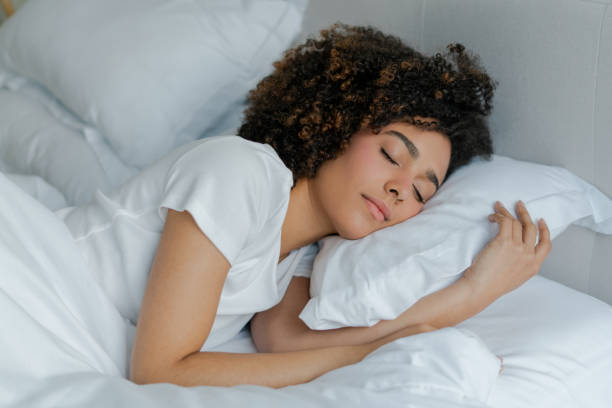 istock Beautiful woman sleeping in bed 1487080824