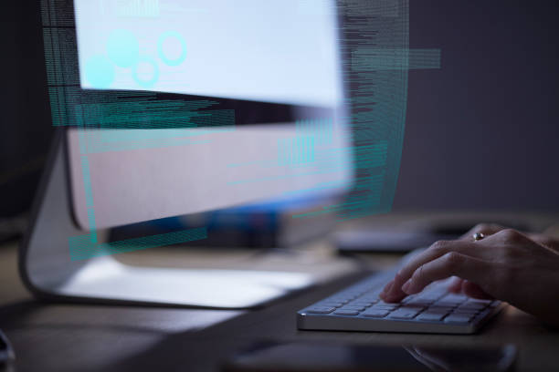 istock Person coding website at night, hands typing on keyboard in the dark and internet technology with digital overlay. IT student working on project, online research on computer and future closeup 1487081028