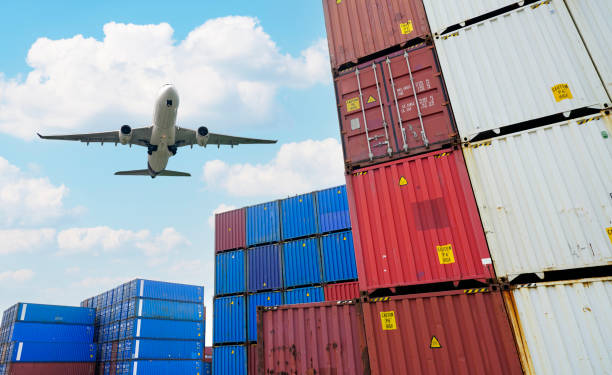 istock Cargo airplane flying above logistic container. Air logistic. Cargo and shipping business. Container ship for import and export logistic. Logistic industry. Container at harbor. Merchandise export. 1487081759