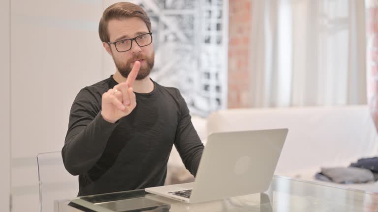 No, Rejecting Young Adult Man Waving Finger at Work