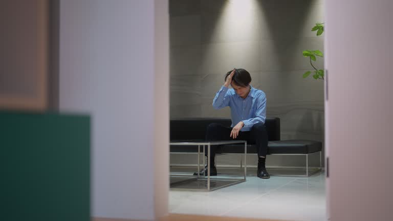 Businessman having hard time and feeling uneasy in office