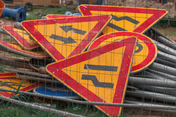 istock Pile of various traffic signs on road maintenance construction site 1487086401