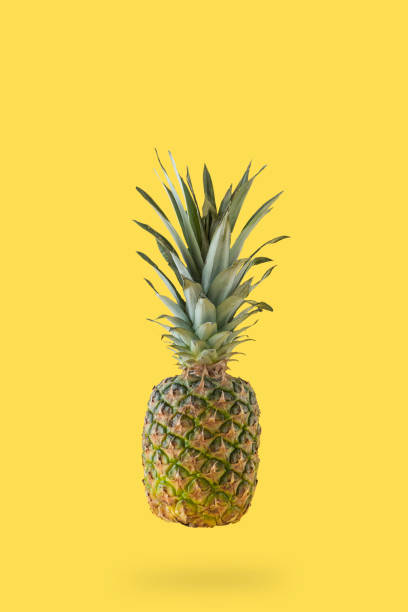istock Creative photos of pineapple on a yellow background 1487086945