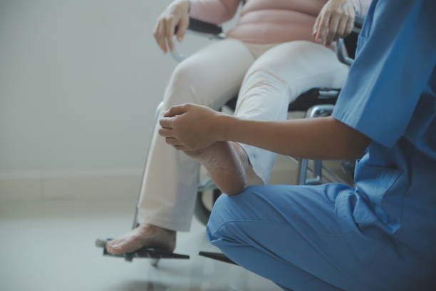 istock young asian physical therapist working with senior woman on walking with a walker 1487087906