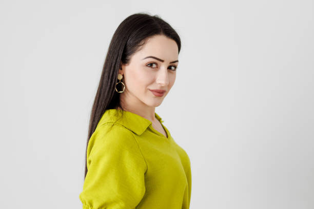 a close-up of fashionable and stylish young woman showcasing her personality in a lime green dress - lime imagens e fotografias de stock