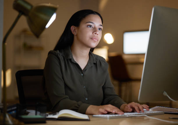 istock Focus, search or woman typing on computer at night planning company strategy, web content or networking. Serious, research or girl on tech for creative idea, business SEO report or email in office 1487089458