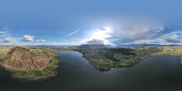 360 aerial photo taken with drone of the entire Laguna Huaypo and the mountain next to it in Sacred Valley.