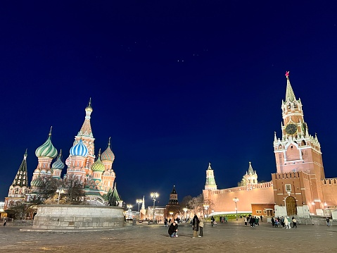 Moscow Kremlin and frozen river on a clear winter day.