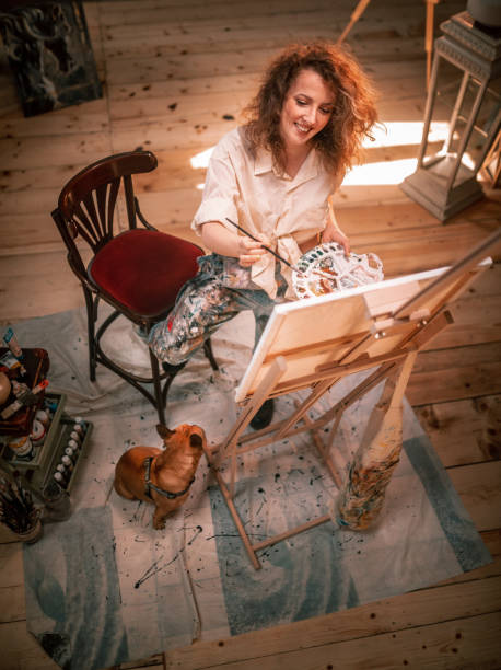istock young female artist working in her studio 1487095107