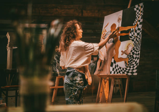 istock young female artist working in her studio 1487095223