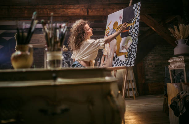 istock young female artist working in her studio 1487095240