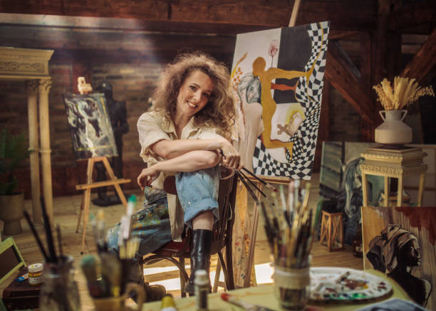 istock young female artist working in her studio 1487095304