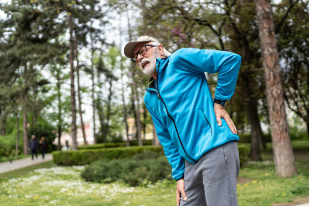 istock Sporty senior man having a back pain 1487096324