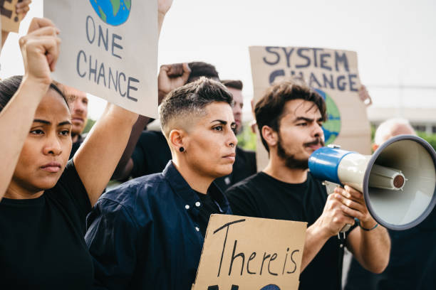 istock Demonstration of multiracial activists protesting for climate change - Global warming concept 1487098743