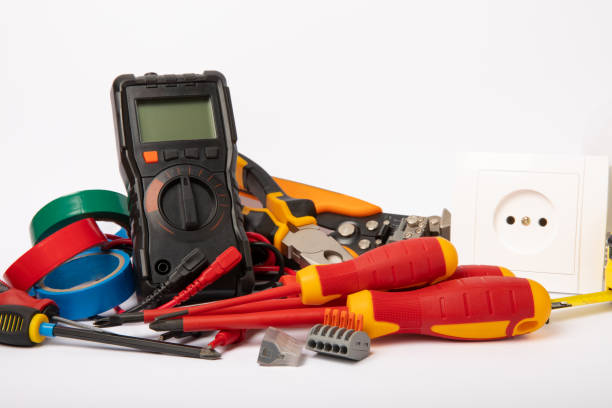istock Electrician tools isolated on white background.Electrician tools set. Multimeter, construction tape, electrical tape, screwdrivers, pliers, LED lamp, socket, switch and automatic insulation stripper. 1487099645