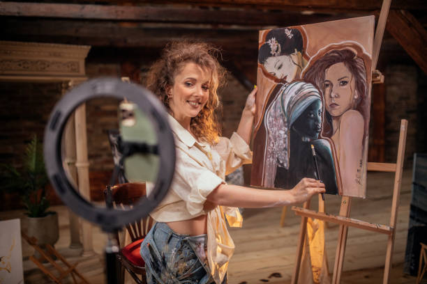 female artist during online class from her art studio