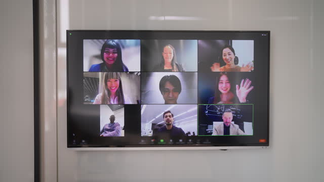 Group of business people joining online business conference meeting in office
