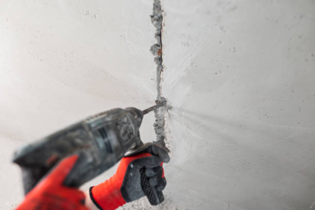 istock Installation of electrical outlets in a concrete wall 1487103555
