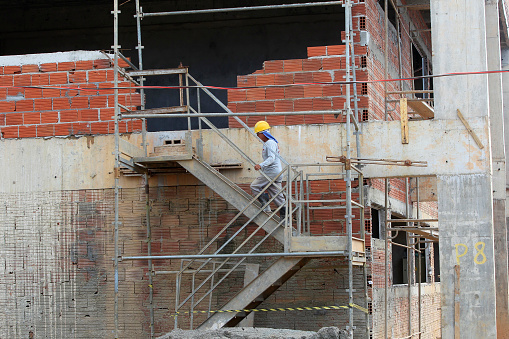 ilheus, bahia, brazil - may 24, 2022: worker in the construction of a public school in the city of Ilheus, in the south of Bahia.