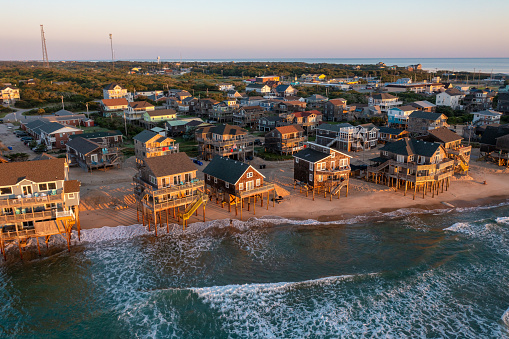 Aerial view of beach homes at sunrise in Buxton North Carolina looking west
