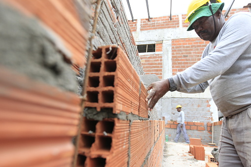 ilheus, bahia, brazil - may 24, 2022: worker in the construction of a public school in the city of Ilheus, in the south of Bahia