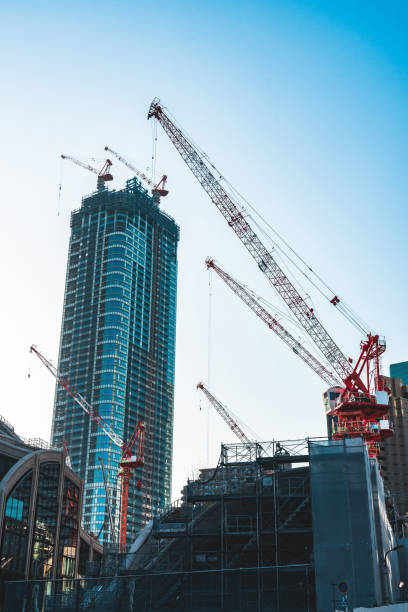 istock Construction with cranes in Tokyo City 1487109451