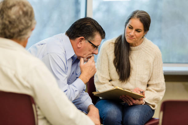 istock Therapy group waits patiently for mature man to share problems 1487109697