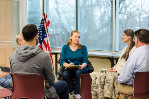 istock Mature female therapist leads veteran support group 1487109719