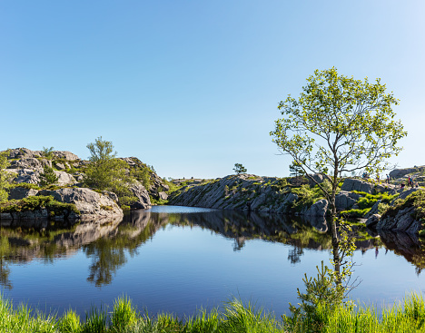 Panorama of a beautiful pond on the trail to the Preikestolen near Stavanger, Norway