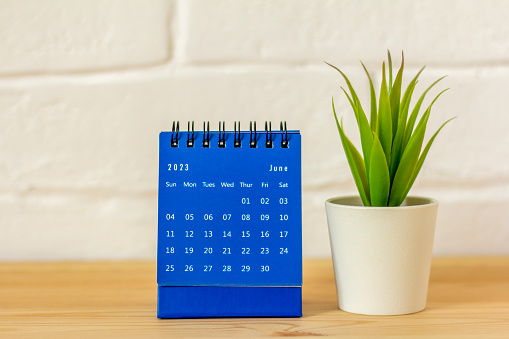 June 2023 on the calendar.Desktop calendar for planning on the table