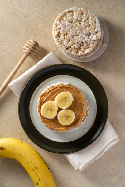 istock Rice cake with banana and peanut butter, top view 1487112187