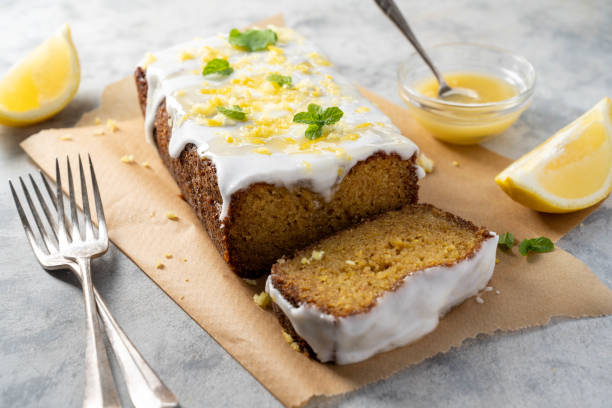 istock Lemon drizzle loaf cake, homemade sponge soft cake with sugar icing 1487112775