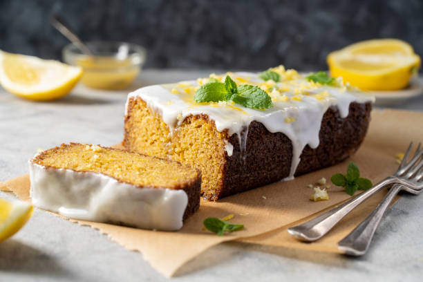 istock Lemon drizzle loaf cake, homemade sponge soft cake with sugar icing 1487112800