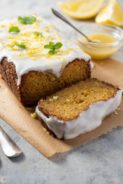 istock Lemon drizzle loaf cake, homemade sponge soft cake with sugar icing 1487112850