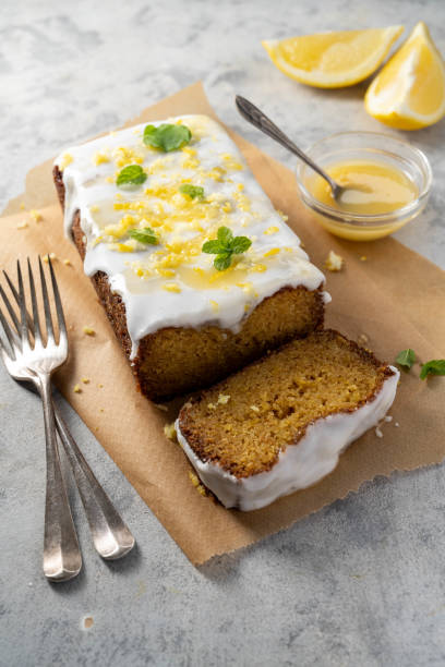 istock Lemon drizzle loaf cake, homemade sponge soft cake with sugar icing 1487112853