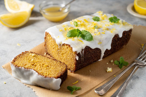 Lemon drizzle loaf cake, homemade sponge soft cake with sugar icing.