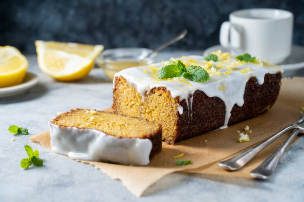 istock Lemon drizzle loaf cake, homemade sponge soft cake with sugar icing 1487112880