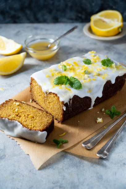 istock Lemon drizzle loaf cake, homemade sponge soft cake with sugar icing 1487112902