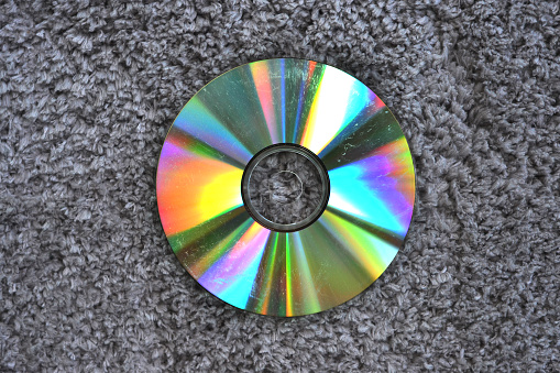 The disc lies on the gray floor
